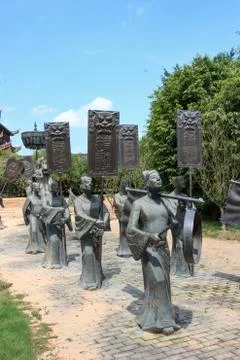 Bronze statue of keep silence and make way Stock Photos