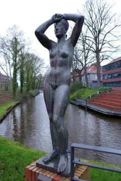 A bronze statue of a nude Stock Photos