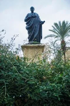 Bronze Statue of Seneca the Younger between jasmine garden Stock Photos