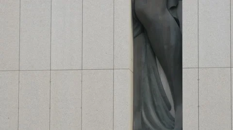 A bronze statue of a voluptuous Goddess encased in granite at AC Hotel, Nice Stock Footage