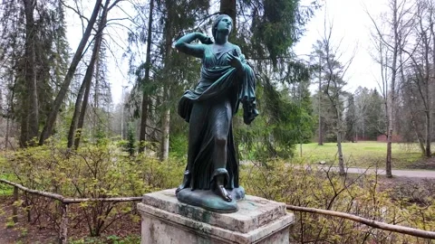 Bronze statues in the spring park. Slowmotion Stock Footage 337784375