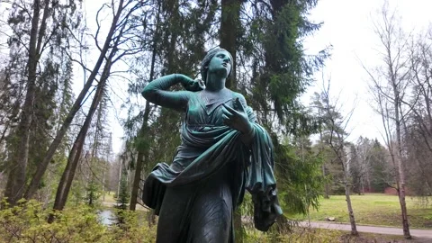 Bronze statues in the spring park. Slowmotion Stock Footage 337784378