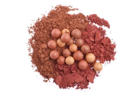 Bronzing pearls with eyeshadows Stock Photos