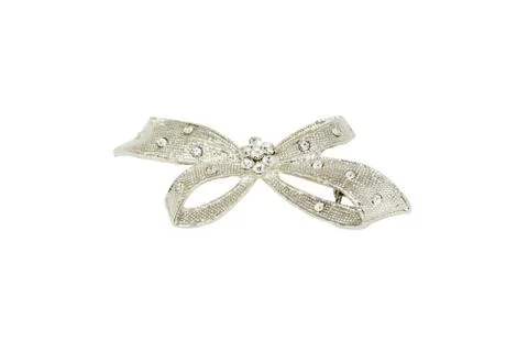 Brooch in the shape of a bow on  white background Stock Photos