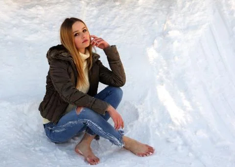 Brooding barefoot girl. Stock Photos