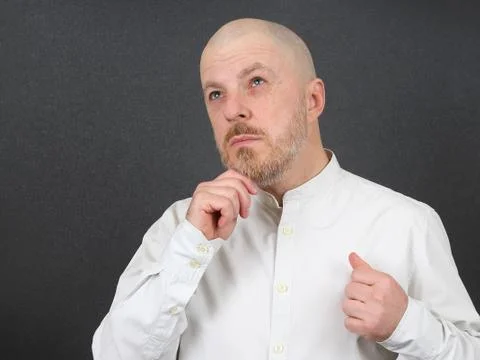 Brooding bearded man in shirt Stock Photos