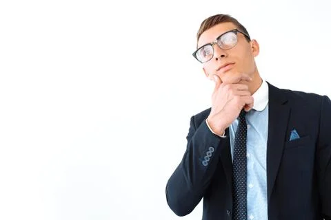 Brooding business man in glasses and suit isolated on white background Stock Photos