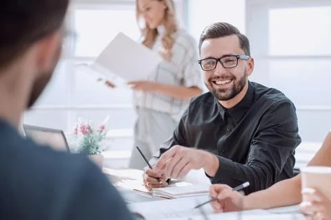 Brooding business man standing in his office Stock Photos