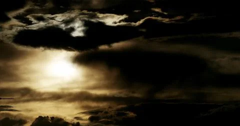 Brooding cloudscape with intense backlighting and ominous clouds. Fotos de archivo