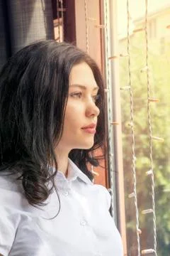 Brooding girl posing inside Stock Photos
