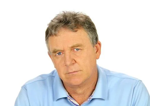 Brooding Middle Aged Man Brooding middle aged man looks directly to camera... Stock Photos