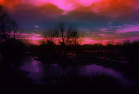Brooding storm and sunset over flooded meadow Stock-Illustration