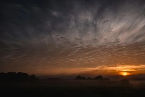 Brooding Twilight over Shrouded Fields Stock Photos