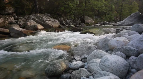 A brook flows over rocks in beautiful scene in spring mountains Stock Footage 39465693