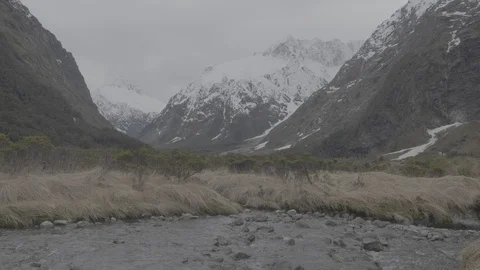 Brook with Snowy Mountain 4k Stock Footage 124510346