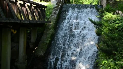 Brook stream flow run old retro water mill cascade zoom out Stock Footage 14123139