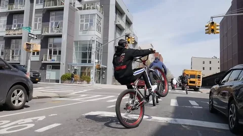 Brooklyn BMX Biker Kid Doing Swerving Wheelies In Street Video stock 128085739