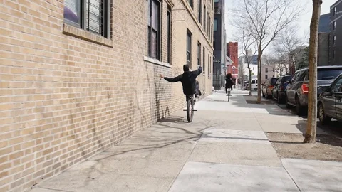Brooklyn BMX Biker Kid Doing Wheelie Touching Wall Stock Footage 128085743