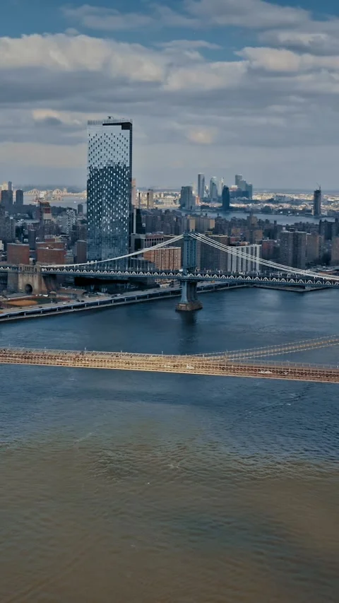 Brooklyn Bridge aerial view showcasing New York skyline and waterways Stock Footage 304280786