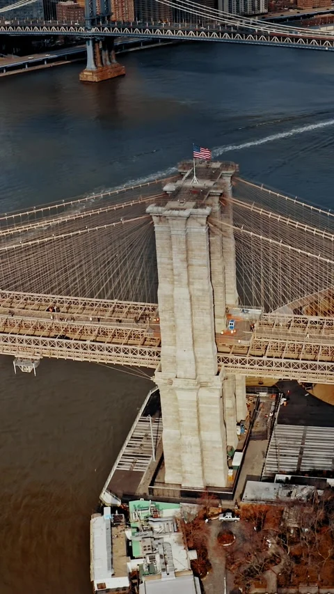 Brooklyn Bridge aerial view showcasing intricate architecture over water Stock Footage 304281043