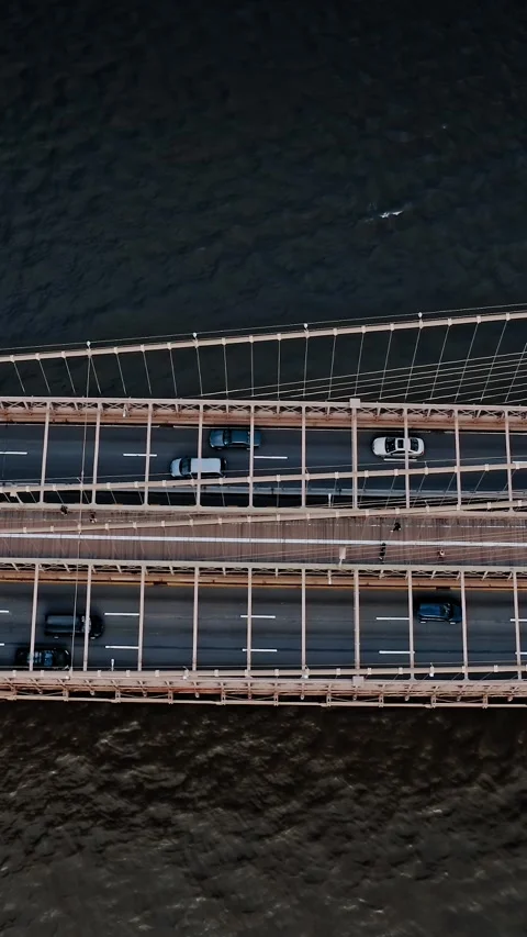 Brooklyn Bridge aerial view showcasing its structure and traffic movement Stock Footage 304281118