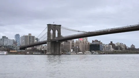 Brooklyn Bridge and Brooklyn DUMBO from Manhattan on an overcast afternoon Stock Footage 79550378