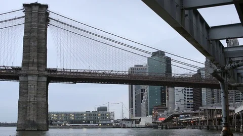 Brooklyn Bridge and lower Manhattan on an overcast evening Stock Footage 79547408