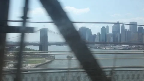 Brooklyn Bridge and Lower Manhattan Skyline View from Moving Train Stock Footage 341468548