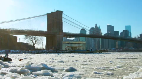 Brooklyn Bridge and New York City Skyline during a cold winter day Stock Footage