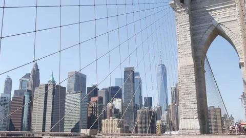 Brooklyn Bridge cables, Manhattan downtown. New York City skyline, financial Stock Footage 288798607