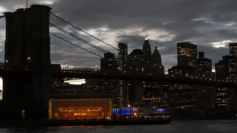 Brooklyn Bridge, Dumbo carousel. New York City Manhattan downtown skyline Stock Footage 302146402