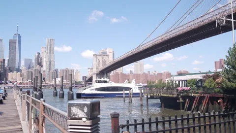 Brooklyn Bridge, Dumbo waterfront. New York City Manhattan downtown skyline Stock Footage 315480909