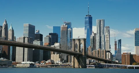 Brooklyn bridge during sunset over Manhattan with Cityscape of New York, USA. 4K Stock Footage 117731114