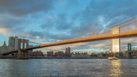 Brooklyn bridge during sunset over Manhattan with Cityscape of New York, USA. Stock Footage 143276192