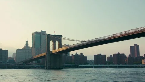 Brooklyn Bridge lit by sunset lights Stock Footage 79850260