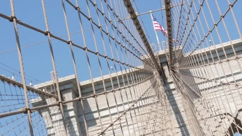 Brooklyn Bridge to Manhattan downtown, cables and blue sky. New York City iconic Stock Footage 290293995
