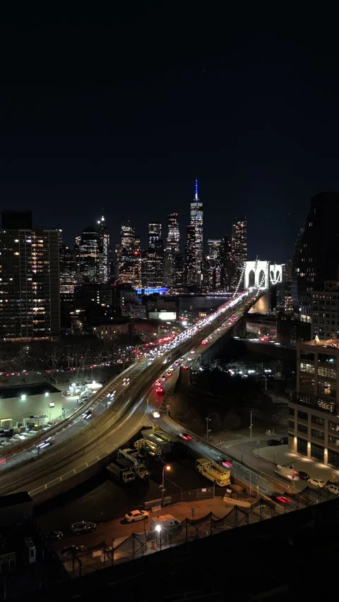 Brooklyn Bridge Night Time Lapse: Elevated View of NYC Traffic and Light Trails Stock Footage 324921919