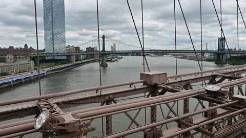 The Brooklyn Bridge is one of the most iconic architectural works of art in.. Stock Footage 310657820