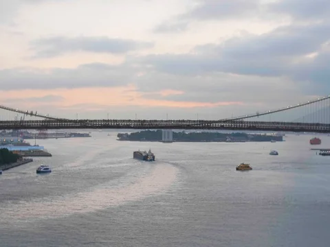 Brooklyn Bridge over the Hudson during sunset Stock Footage 81705593