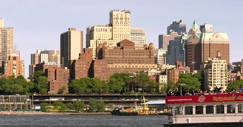 Brooklyn Bridge Park view with sigtseeing ferry boat passing by Stock Footage 77262095