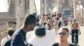 Brooklyn Bridge people walking crowded traffic New York City NYC day slow motion HD Footage