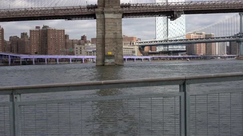 Brooklyn Bridge spanning East River and Tourists walking across Bridge. Stock Footage 149381819
