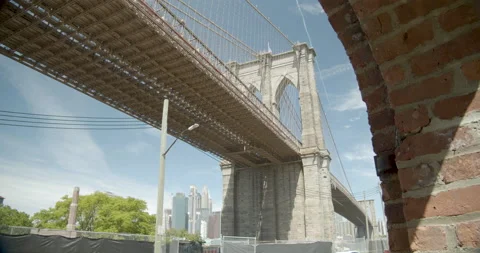 Brooklyn bridge through a brick building Stock Footage 131202738
