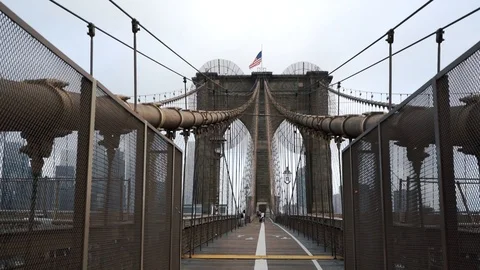 Brooklyn Bridge through East River to Manhattan Stock Footage 126428347