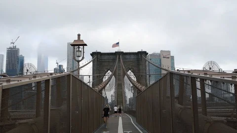 Brooklyn Bridge through East River to Manhattan Stock Footage 126430246