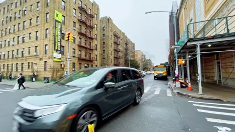 Brooklyn intersection with school bus and police vehicle Stock Footage 335203212