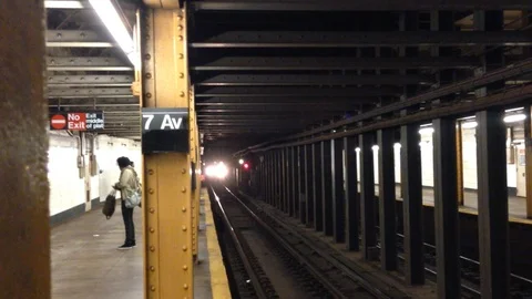Brooklyn, New York, the B train pulls into the 7th St station. Stock Footage 90155656