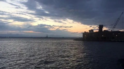 Brooklyn Red Hook view of the Statue of Liberty NX nighttime establishing shot Stock Footage 78118622