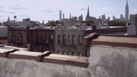 Brooklyn rooftops with Manhattan view and St Anthony of Padua Church steeple. Stock Footage 75262740