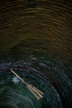 Broom in a well Stock-Fotos